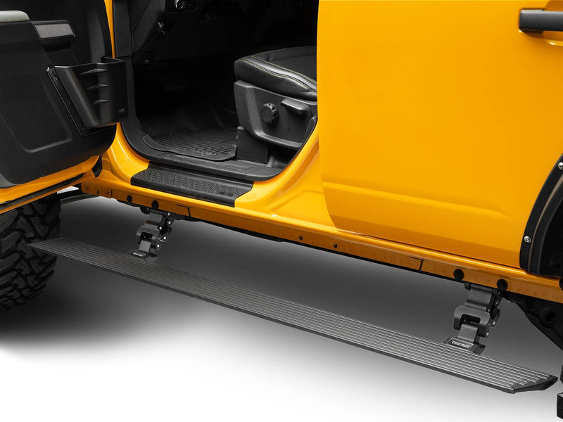Go Rhino VoltStep: black power running board deployed under the open doors of a yellow Bronco 4-door