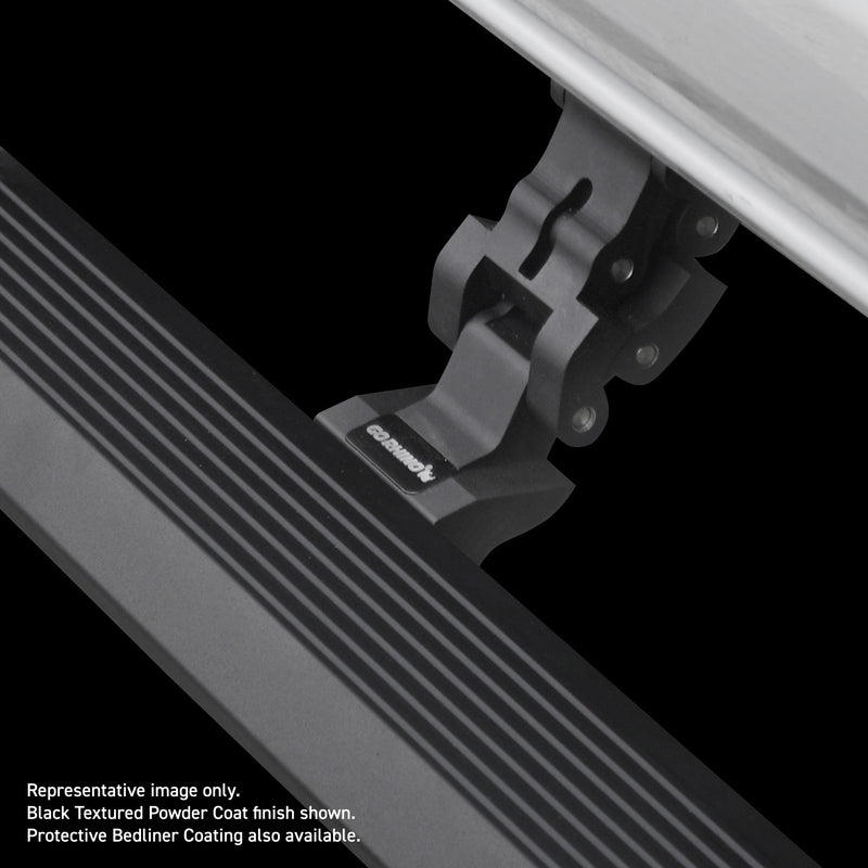 Go Rhino VoltStep: close-up of a black motorised linkage arm with GO RHINO lettering holding a ribbed step board under a silver body, on black