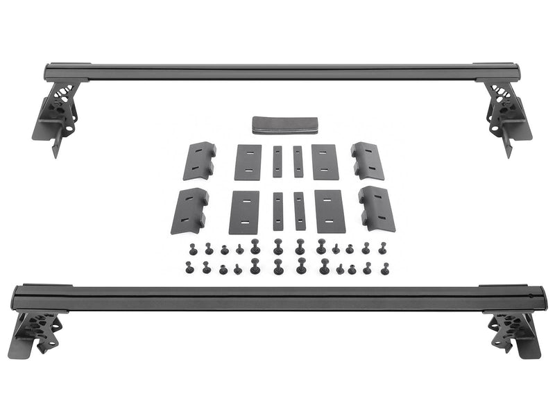 Go Rhino XRS: two black cross bars with towers, mounting clamps and hardware laid out