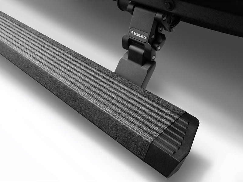 Close-up of a bedliner-coated power running board end cap and folding hinge arm (bedliner finish)