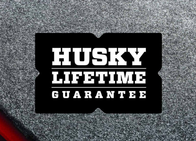 Husky Liners Guardian Comfort: husky Lifetime Guarantee badge on gray carpet texture