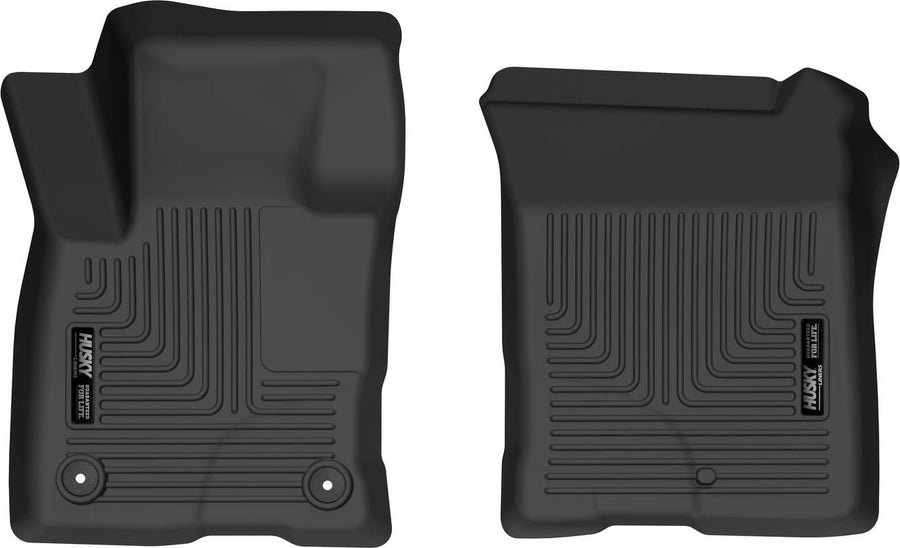 Husky Liners X-act Contour Floor Liners: Two black front floor liners on white, driver side with two retention posts