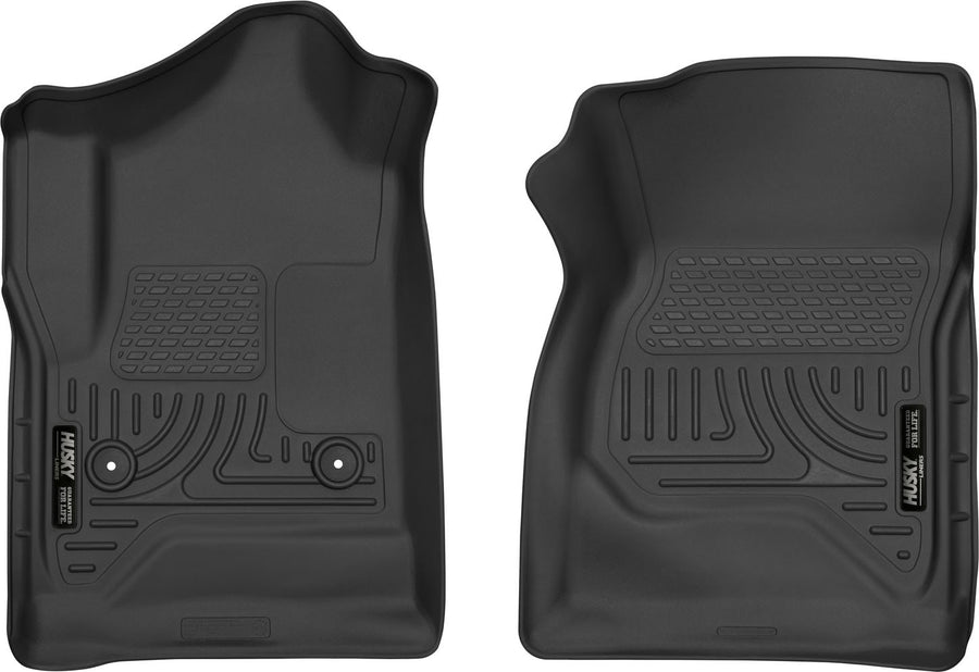 Husky Liners X-act Contour Floor Liners: Two black front floor liners on white, driver side with two retention posts