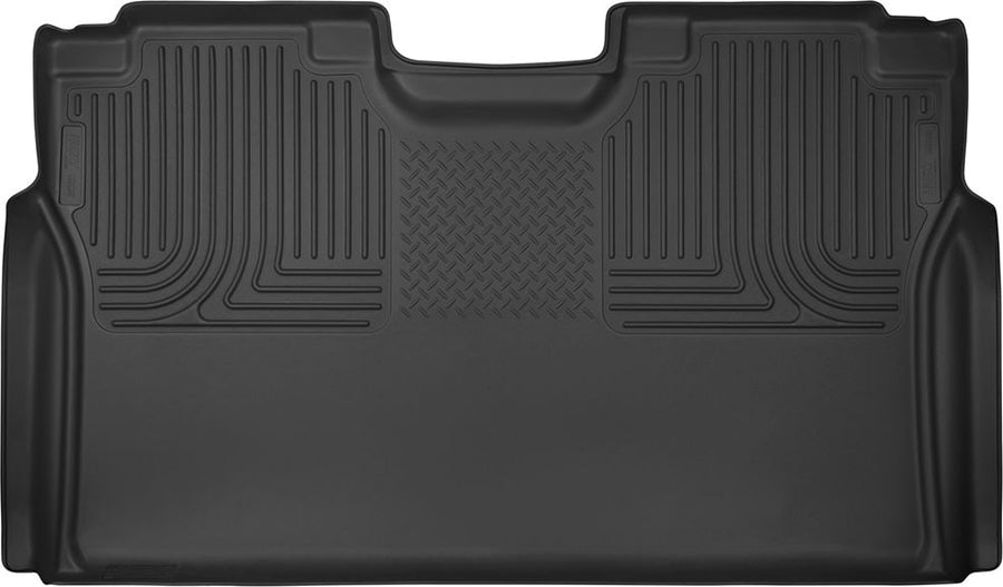 Husky Liners X-act Contour Floor Liners: Black molded one-piece rear floor liner with Husky Liners logo plates on a white background