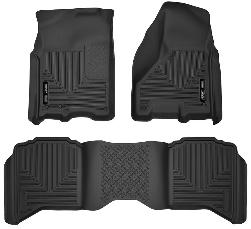 Husky Liners X-act Contour: black molded front floor liner pair with matching rear floor liner with Husky Liners logo plates on a white background