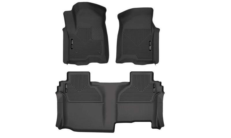 Husky Liners X-act Contour: black molded front floor liner pair with matching rear floor liner with Husky Liners logo plates on a white background