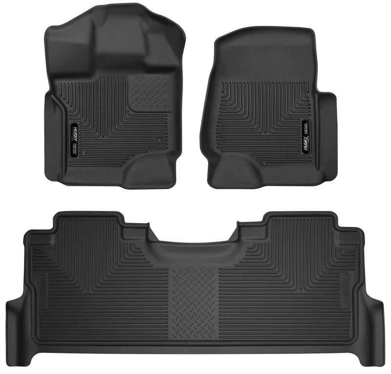 Husky Liners X-act Contour: black molded front floor liner pair with matching rear floor liner with Husky Liners logo plates on a white background