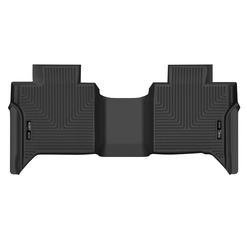Husky Liners X-act Contour: black X-act Contour one-piece second-row floor liner on a white background