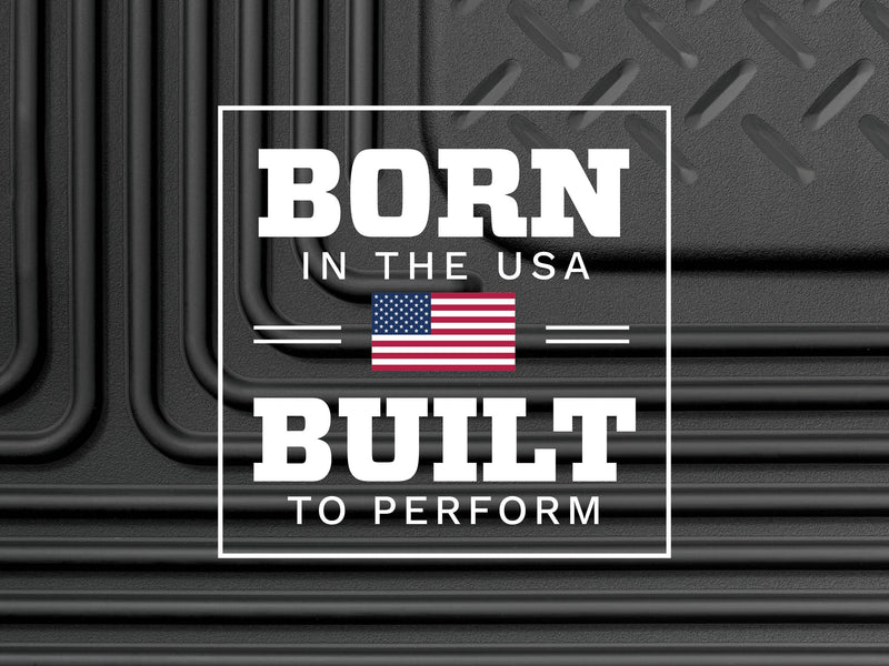 Husky Liners X-act Contour: born in the USA, Built to Perform badge with US flag over a black diamond-plate liner texture