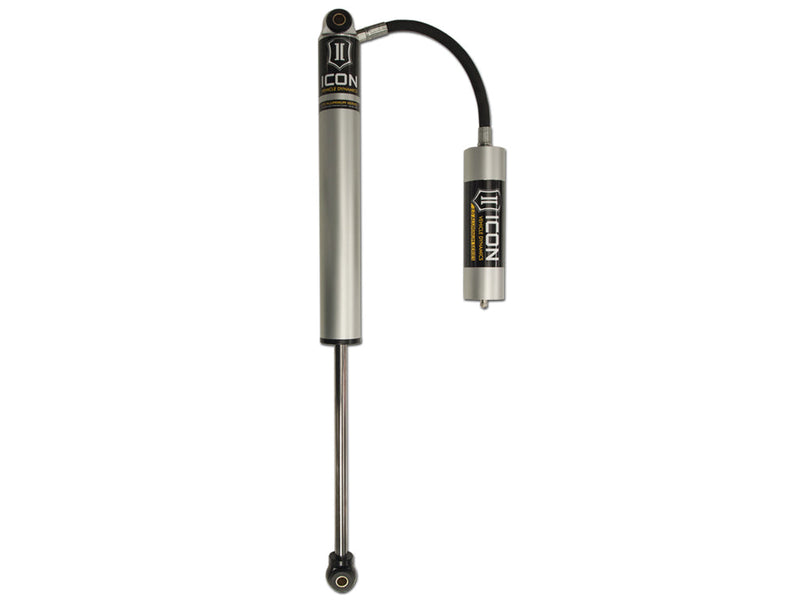 ICON Vehicle Dynamics 2.0 Series Shock Absorber: silver ICON 2.0 aluminum series shock with hose-linked remote reservoir and eyelet ends on white
