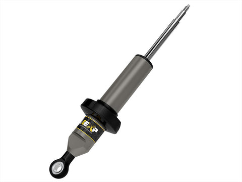 ICON Vehicle Dynamics 2.5 EXP Series Coilover: ICON 2.5 EXP front coilover body with black spring perch, threaded stem top and eyelet base on white