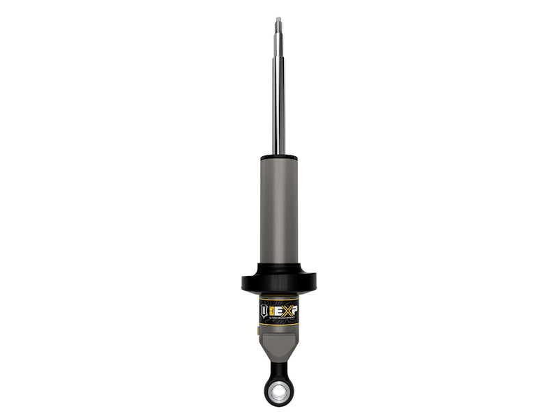 ICON Vehicle Dynamics 2.5 EXP Series Coilover: ICON 2.5 EXP front coilover body with black spring perch, threaded stem top and eyelet base on white (part 58671)