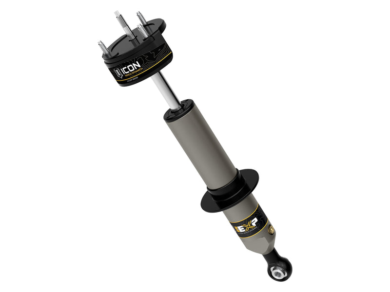 ICON Vehicle Dynamics 2.5 EXP Series Coilover: ICON 2.5 EXP front coilover with ICON-labeled three-stud upper mount, black spring perch and eyelet base, angled on white