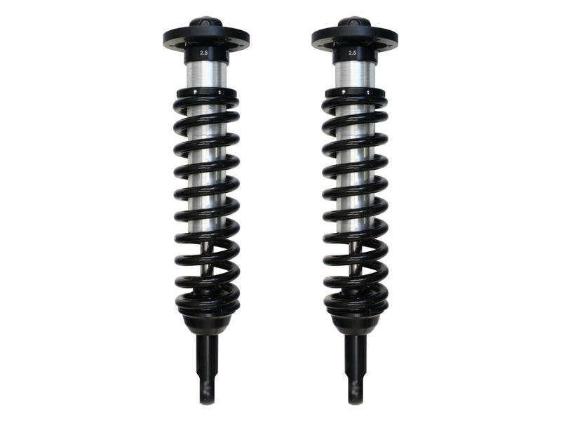 ICON Vehicle Dynamics 2.5 Series Coilover Kit: a pair of ICON 2.5 VS internal-reservoir front coilovers with black springs and stem lower mounts, on white