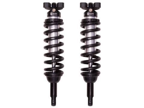 ICON Vehicle Dynamics 2.5 Series Coilover Kit: a pair of ICON 2.5 VS internal-reservoir front coilovers with black springs, three-stud tops and stem lower mounts, on white