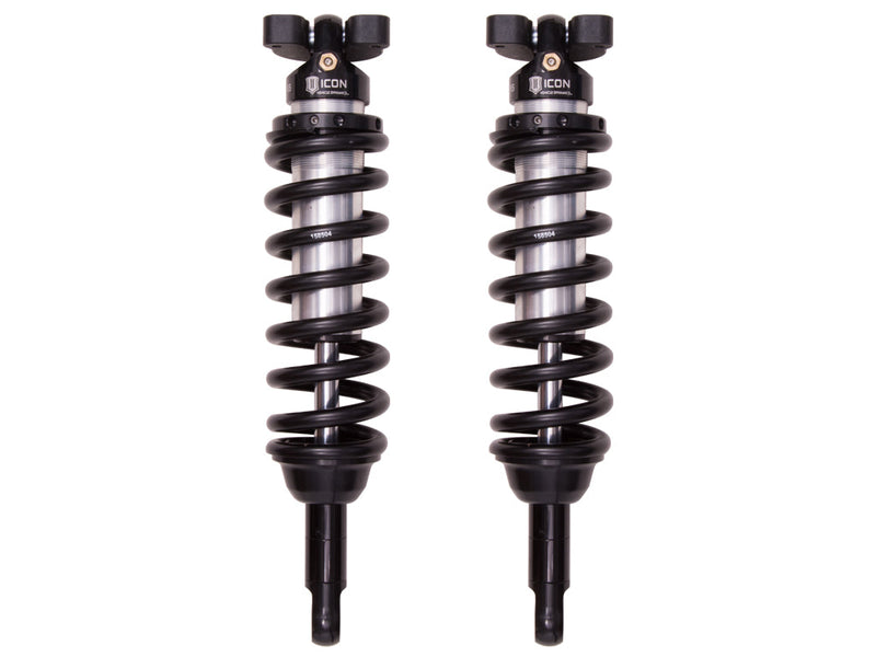 ICON Vehicle Dynamics 2.5 Series Coilover Kit: a pair of ICON 2.5 VS internal-reservoir front coilovers with black springs, three-stud tops and stem lower mounts, on white