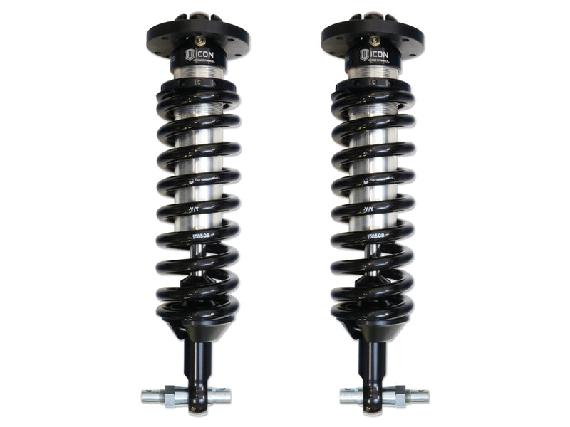 ICON Vehicle Dynamics 2.5 Series Coilover Kit: a pair of ICON 2.5 VS internal-reservoir front coilovers with black springs, round tops and bar-pin lower mounts, on white