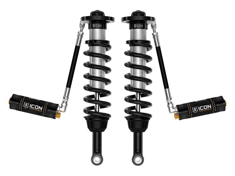 ICON Vehicle Dynamics 2.5 Series Coilover Kit: a pair of ICON 2.5 VS remote-reservoir coilovers with black springs and black ICON 2.5 Aluminum Series reservoirs held out horizontally, on white