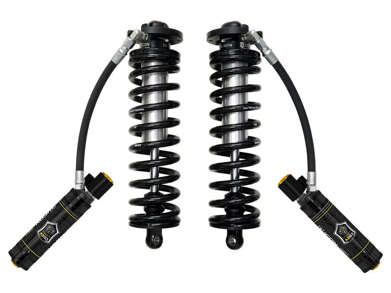 ICON Vehicle Dynamics 2.5 Series Coilover Kit: a pair of ICON 2.5 VS remote-reservoir coilovers with black springs and black electronic-valve reservoirs angled out and down, on white