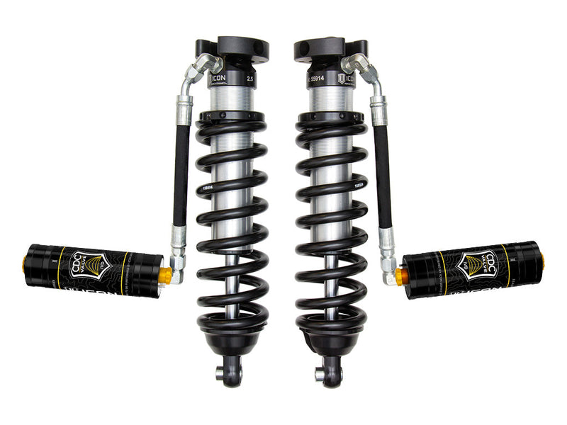ICON Vehicle Dynamics 2.5 Series Coilover Kit: a pair of ICON 2.5 VS remote-reservoir coilovers with black springs and black CDC Valve reservoirs held out horizontally, on white