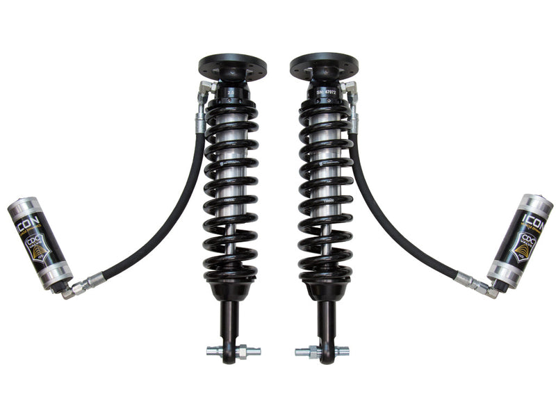 ICON Vehicle Dynamics 2.5 Series Coilover Kit: a pair of ICON 2.5 VS remote-reservoir coilovers with black springs, bar-pin bases and silver ICON reservoirs hanging low on long hoses, on white (part 91816C and 91811C)