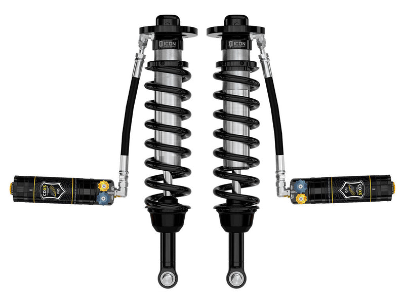 ICON Vehicle Dynamics 2.5 Series Coilover Kit: a pair of ICON 2.5 VS remote-reservoir coilovers with black springs, eyelet bases and CDXS dual-adjuster reservoirs held out horizontally, on white