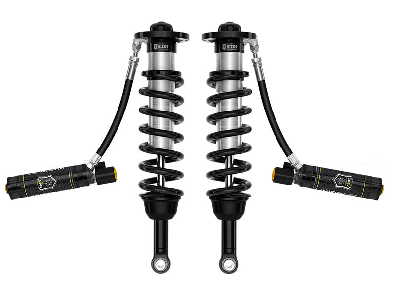 ICON Vehicle Dynamics 2.5 Series Coilover Kit: a pair of ICON 2.5 VS remote-reservoir coilovers with black springs and black CDEV electronic reservoirs held out horizontally, on white