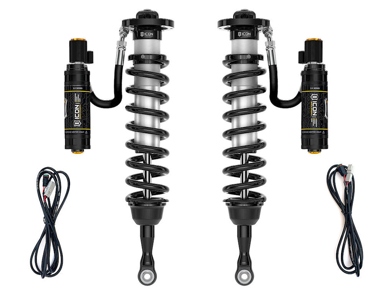 ICON Vehicle Dynamics 2.5 Series Coilover Kit: a pair of ICON 2.5 VS remote-reservoir coilovers with black springs, electronic-valve reservoirs and two wiring harnesses, on white
