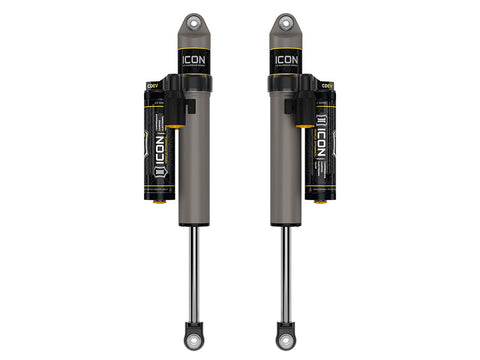 ICON Vehicle Dynamics 2.5 Series Shock Absorbers: rendered pair of gray ICON 2.5 aluminum series shocks with CDEV piggyback reservoirs and eyelet ends on white