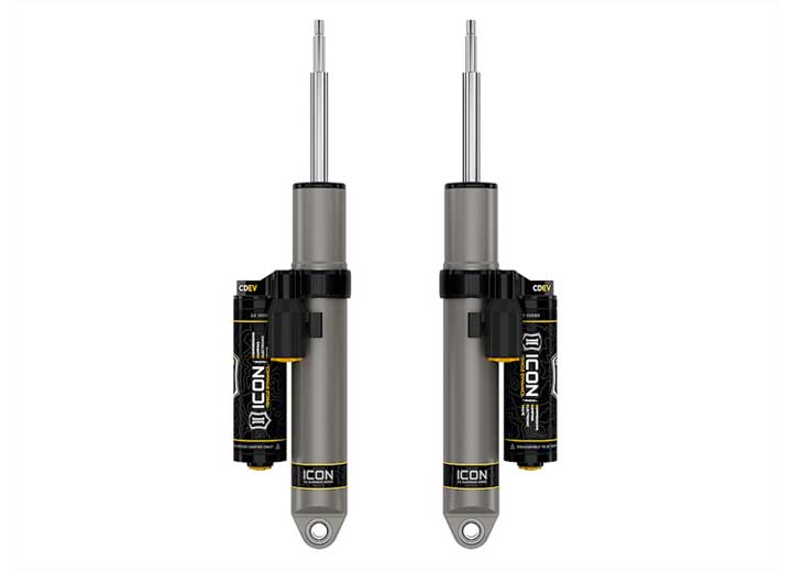 ICON Vehicle Dynamics 2.5 Series Shock Absorbers: rendered pair of gray ICON 2.5 aluminum series shocks with CDEV piggyback reservoirs and stem tops, standing on white (part 217708EP)