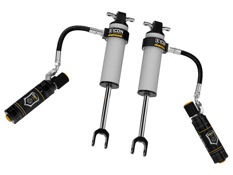 ICON Vehicle Dynamics 3.0 Series Shock Absorbers: rendered pair of gray ICON 3.0 VS remote-reservoir front shocks with crossbar top mounts, fork lower mounts and reservoirs on hoses, on white