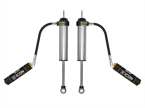 ICON Vehicle Dynamics 3.0 Series Shock Absorbers: rendered pair of silver ICON 3.0 VS remote-reservoir rear shocks with reservoirs angled out on hoses, on white