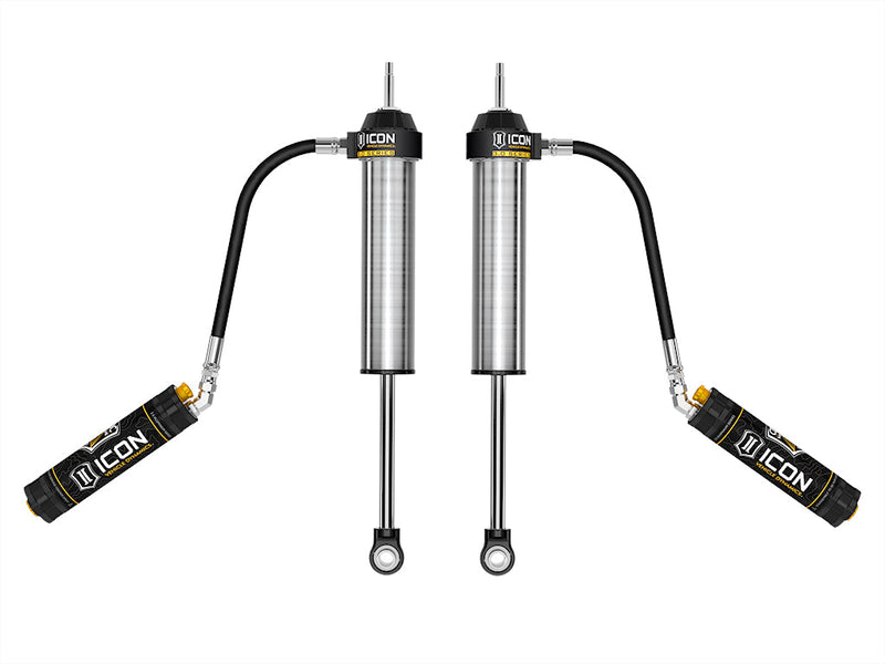 ICON Vehicle Dynamics 3.0 Series Shock Absorbers: rendered pair of silver ICON 3.0 VS remote-reservoir rear shocks with reservoirs angled out on hoses, on white