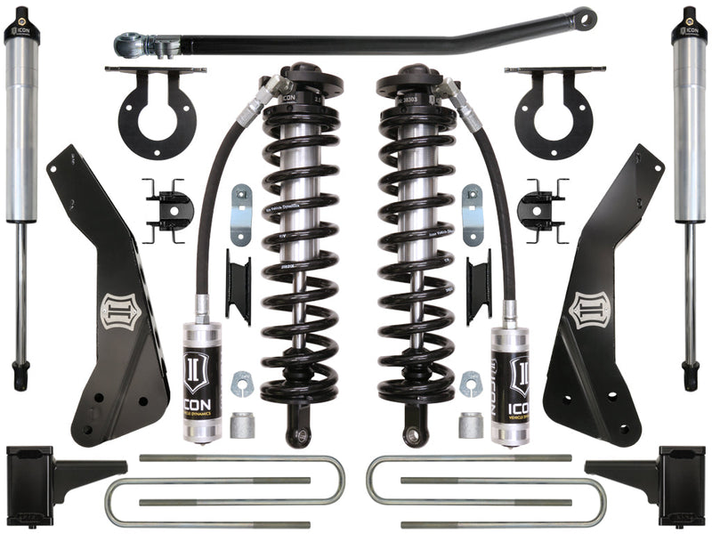 Kit layout on white: two ICON 2.5 remote-reservoir coilovers, two rear shocks, adjustable track bar, coil towers, frame brackets, block mounts and U-bolts.
