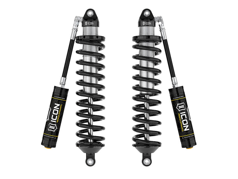 A pair of ICON 2.5 VS remote-reservoir coilovers with black springs, eyelet top and bottom mounts and black ICON reservoirs, on white.