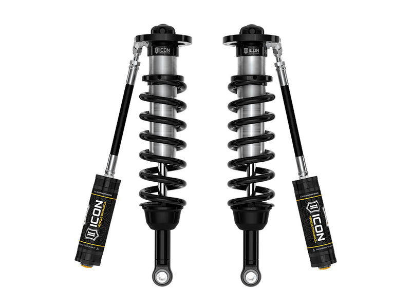 A pair of ICON 2.5 VS remote-reservoir coilovers with black springs and black 2.5 Aluminum Series reservoirs angled beside them, on white.