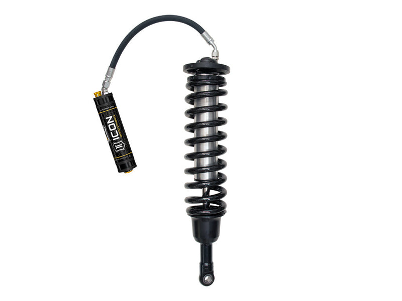 Single ICON 3.0 VS remote-reservoir coilover with black spring and ICON reservoir on an arched hose, standing on white.