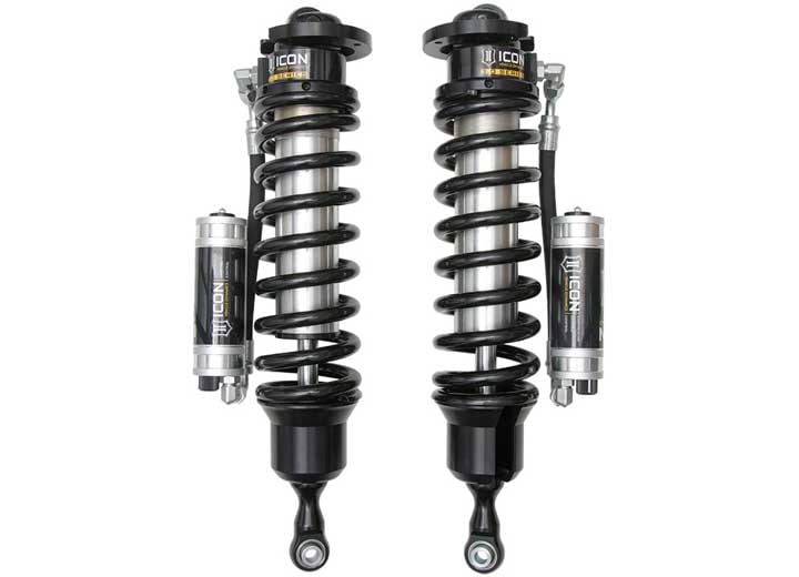 A pair of ICON 3.0 VS remote-reservoir coilovers with black springs and silver CDC reservoirs mounted beside the bodies, on white.