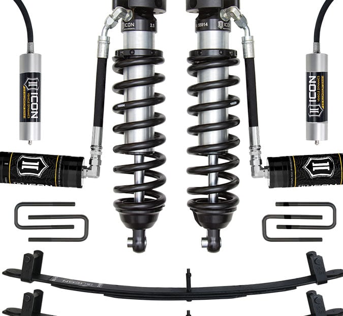 Studio kit layout on white: kit: remote-reservoir front coilovers, rear remote-reservoir shocks, rear leaf packs and U-bolts.