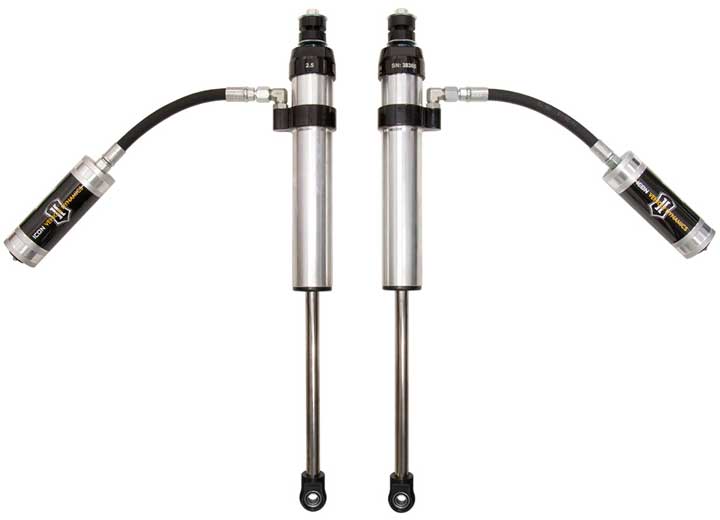 A pair of silver ICON 2.5 VS front shocks with stem tops and silver reservoirs on arched hoses, photographed on white.