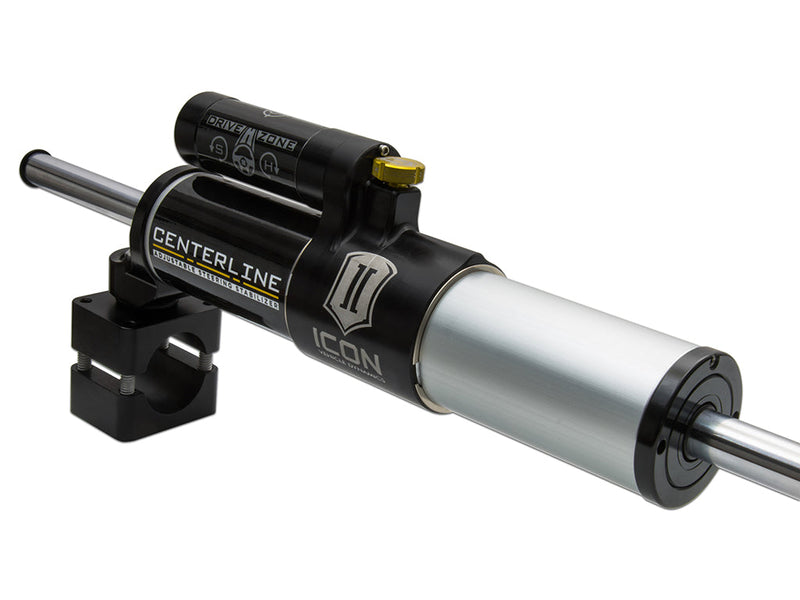 ICON Vehicle Dynamics Ultimate Front End Kit: close-up of a black ICON Centerline adjustable steering stabilizer with Drive Zone selector and clamp on white