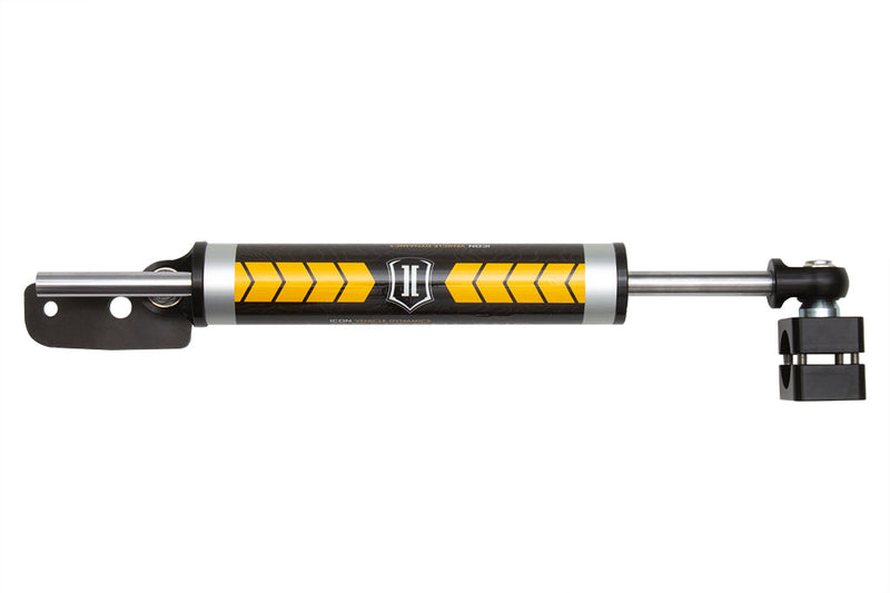 ICON Vehicle Dynamics Ultimate Front End Kit: ICON steering stabilizer with orange chevron graphics, bracket and tie-rod clamp on white