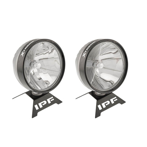 Two IPF Xtreme LED Sport driving lights displayed on branded IPF stands, round black-bezel housings with deep chrome tri-wall reflectors, a central LED emitter and XTREME LED SPORT lettering around the bezel