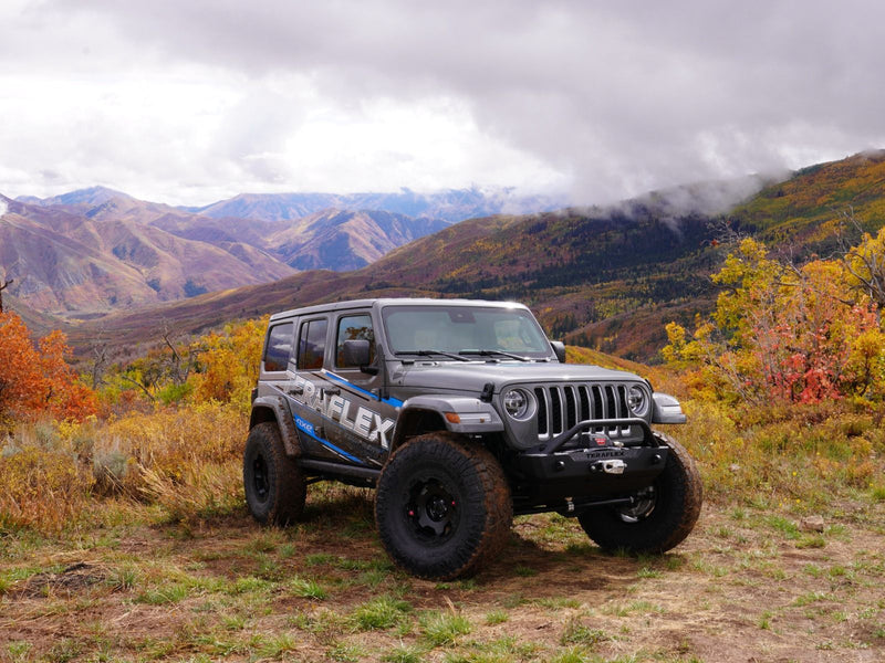 TeraFlex 2.5" Trail Select Adventure Kit installed on a gray Jeep Wrangler JL on a mountain trail