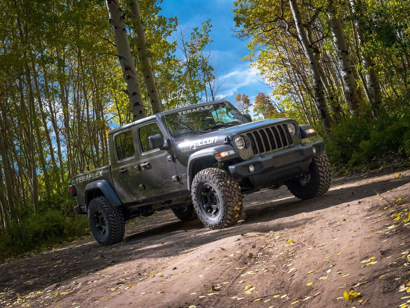 TeraFlex Trail Select Sport Kit installed on a gray Jeep Gladiator JT on a forest trail