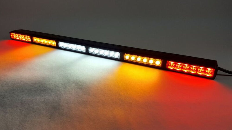 KC HiLiTES 28" Multi-Function Rear-Facing Chase LED Light Bar on a studio background: black LED chase light bar lit with red outer sections, amber inner sections and white center sections on a gray surface