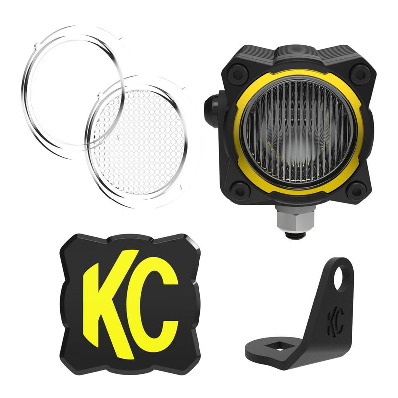 KC HiLiTES FLEX ERA 1 LED Light Pod Master Kit on a studio background: A single FLEX ERA 1 LED pod with two clear lenses, a KC logo cover and a black L-shaped mounting bracket on a white background