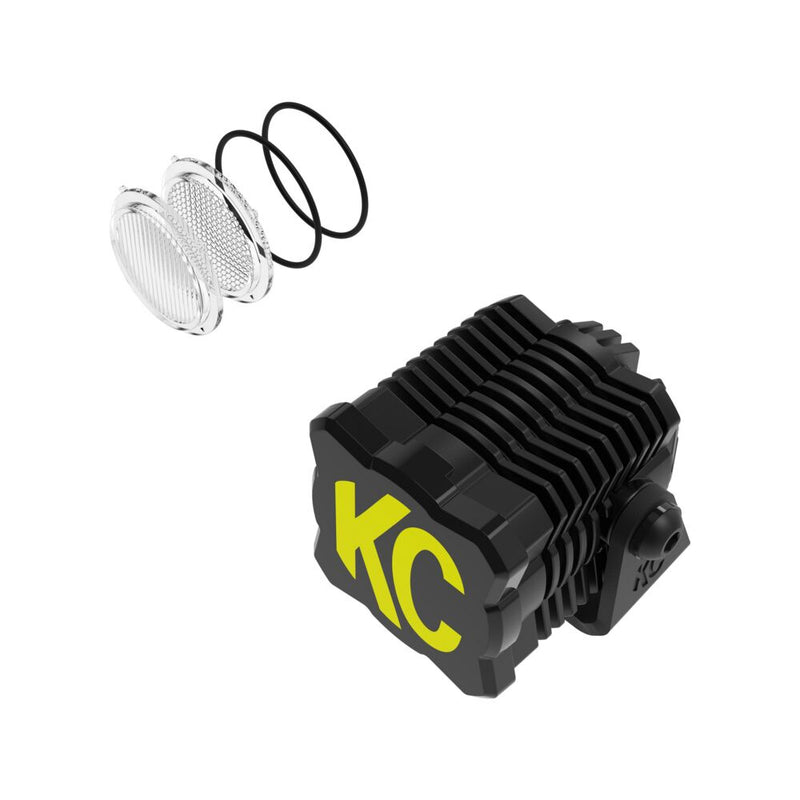 KC HiLiTES FLEX ERA 1 LED Light Pod Master Kit on a studio background: A single FLEX ERA 1 LED cube light pod with a yellow and black KC cover and spare clear lenses on a white background