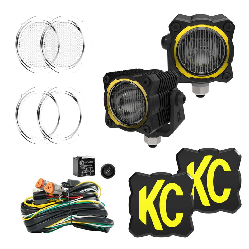 KC HiLiTES FLEX ERA 1 LED Light Pod Master Kit on a studio background: two FLEX ERA 1 LED light pods with lenses, KC logo covers, wiring harness, relay and rocker switch on a white background