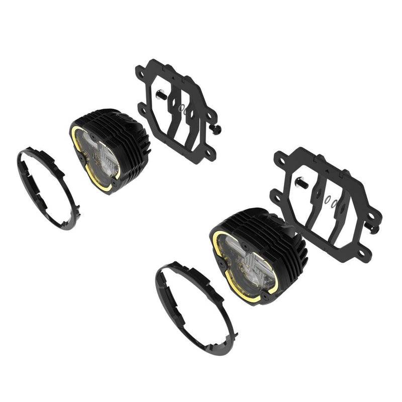 KC HiLiTES FLEX ERA 3 Dual-Mode SAE Fog Light Kit on a studio background: exploded view of two FLEX ERA 3 fog lights with Subaru fog pocket brackets and round shrouds